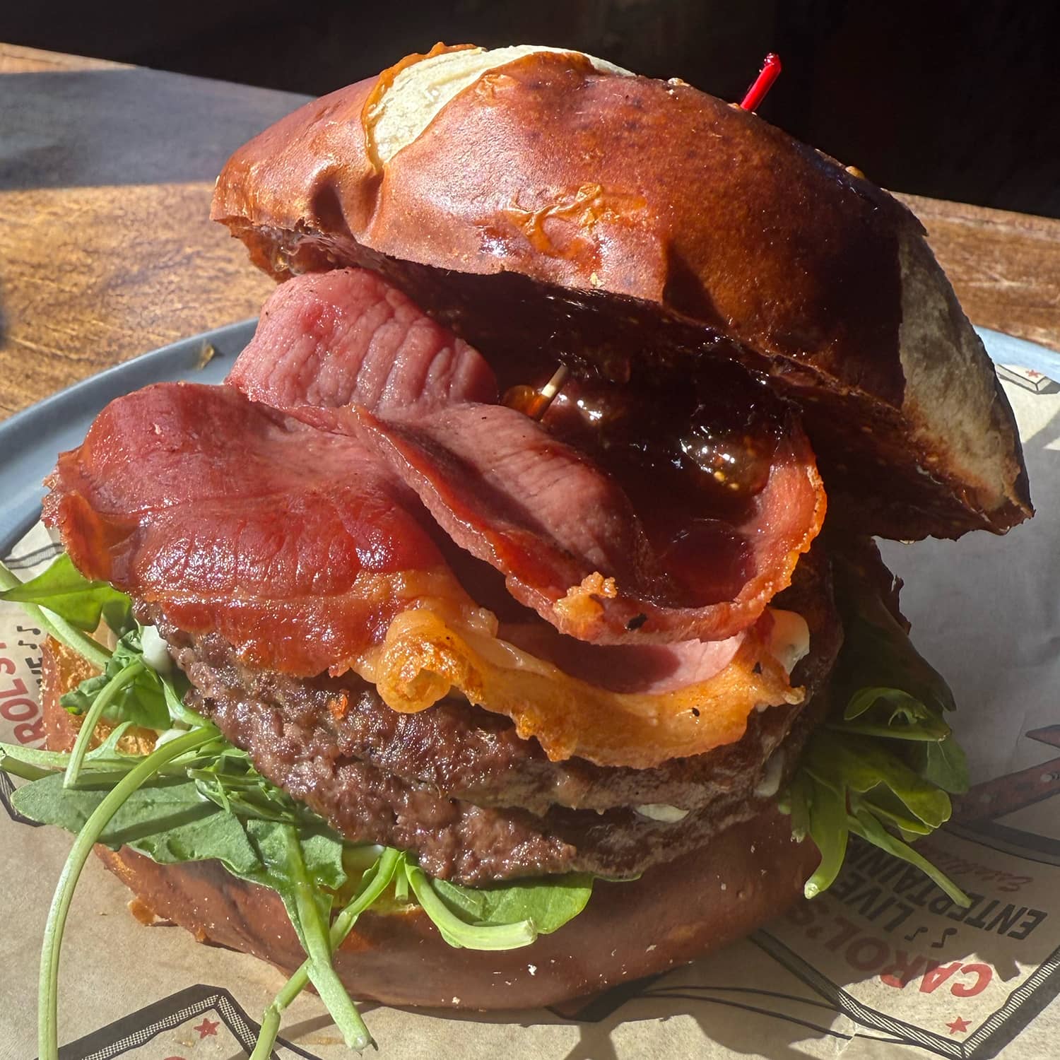 Promotional image for August's Burger of the Month at Carol's Pub: #